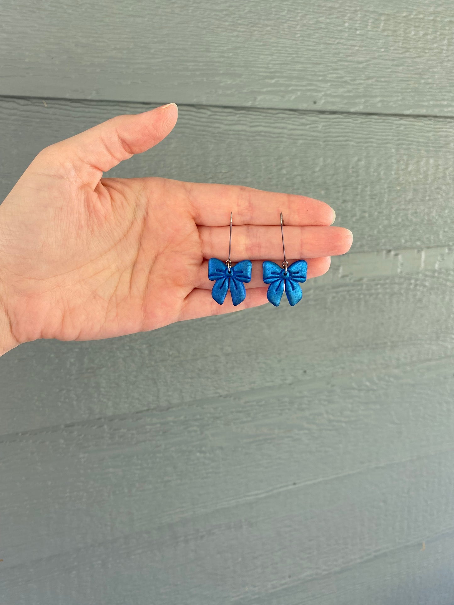 Shiny Blue Bow Dangles