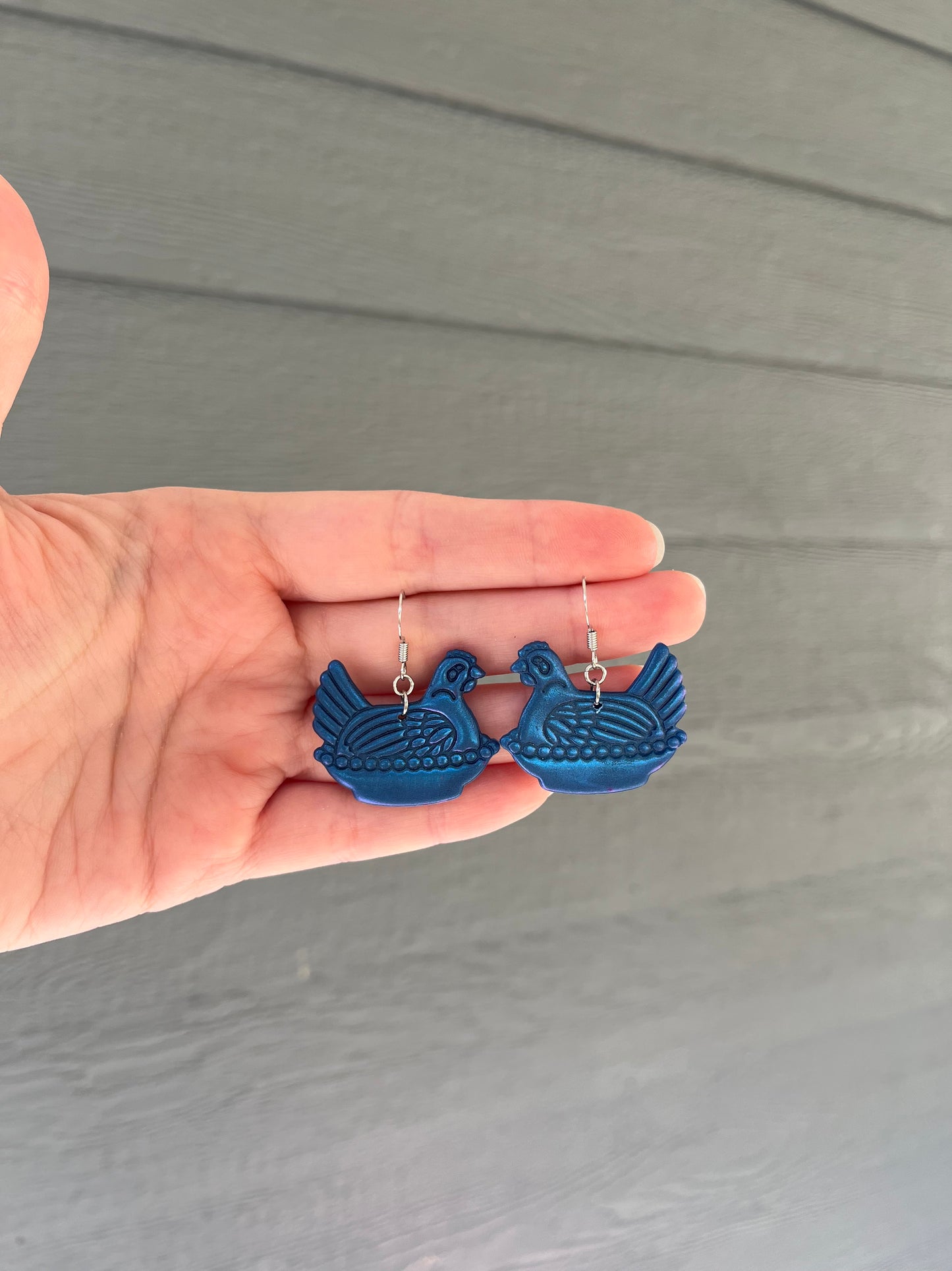 Dark Blue Hen on a Nest